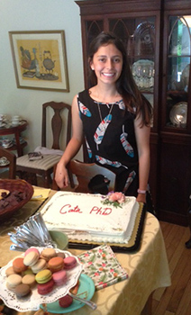 Cata in front of her PhD cake